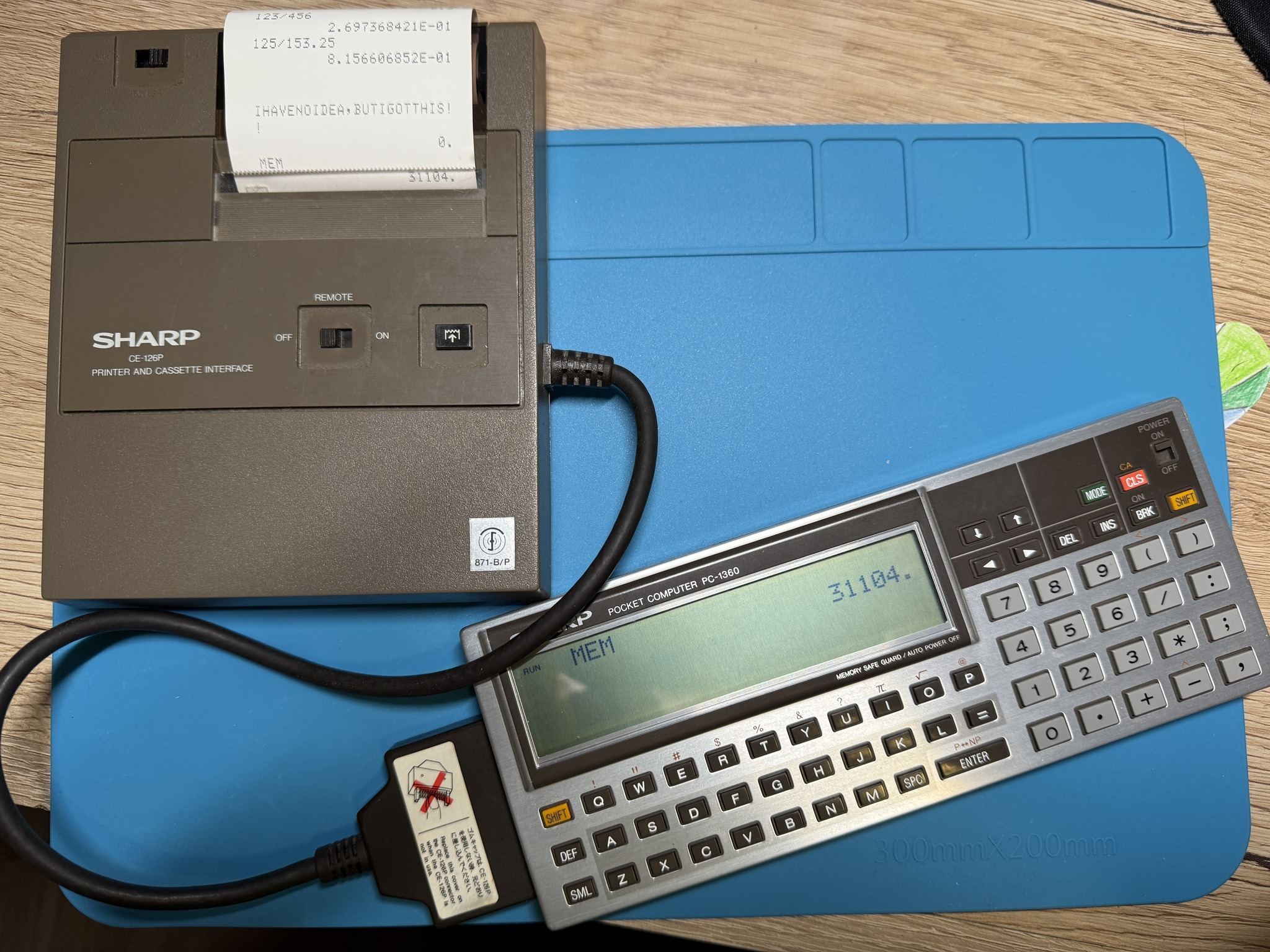 A Sharp PC-1260 Pocket Computer , complete with a Sharp CE-125