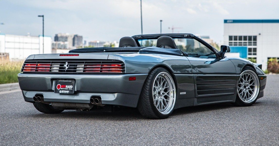 The Ferrari 348 Spider's dramatic side strakes and pop-up