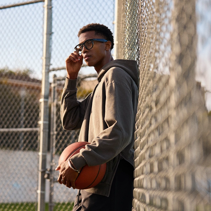 A person using the Meta AI glasses hands-free controls