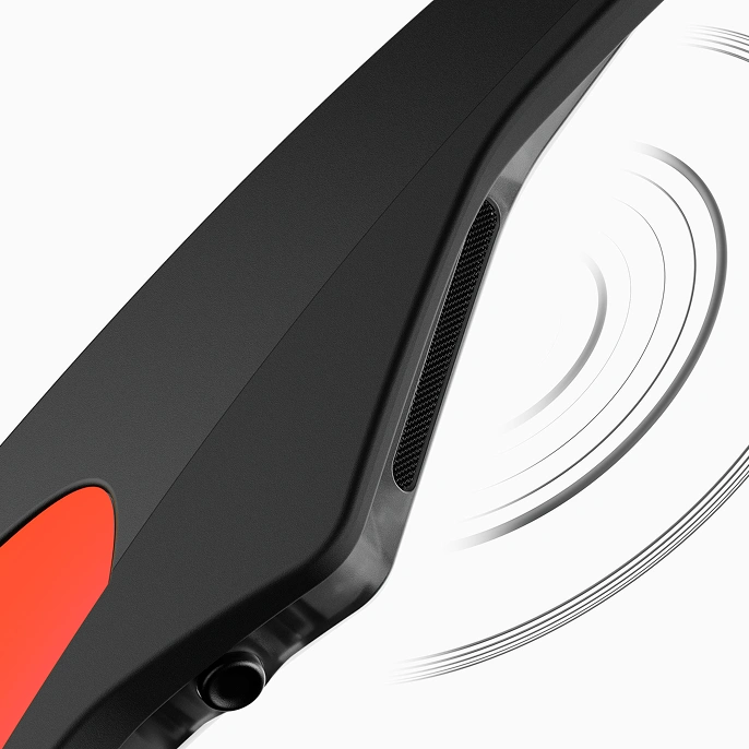 Close up of the Oakley Meta AI glasses' open-ear speaker, a thin oblong bar with stylized soundwaves radiating outward.