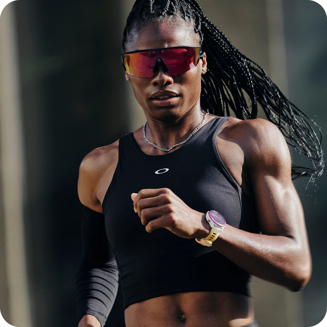 Person running outdoors in Oakley Meta performance sunglasses with red shield lens.